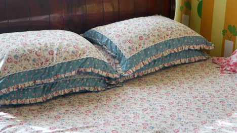 floral bedding on a bed