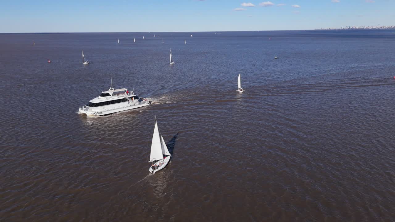 Windsurfers enjoy sunny day on Rio De La Plata, Argentina Uruguay border