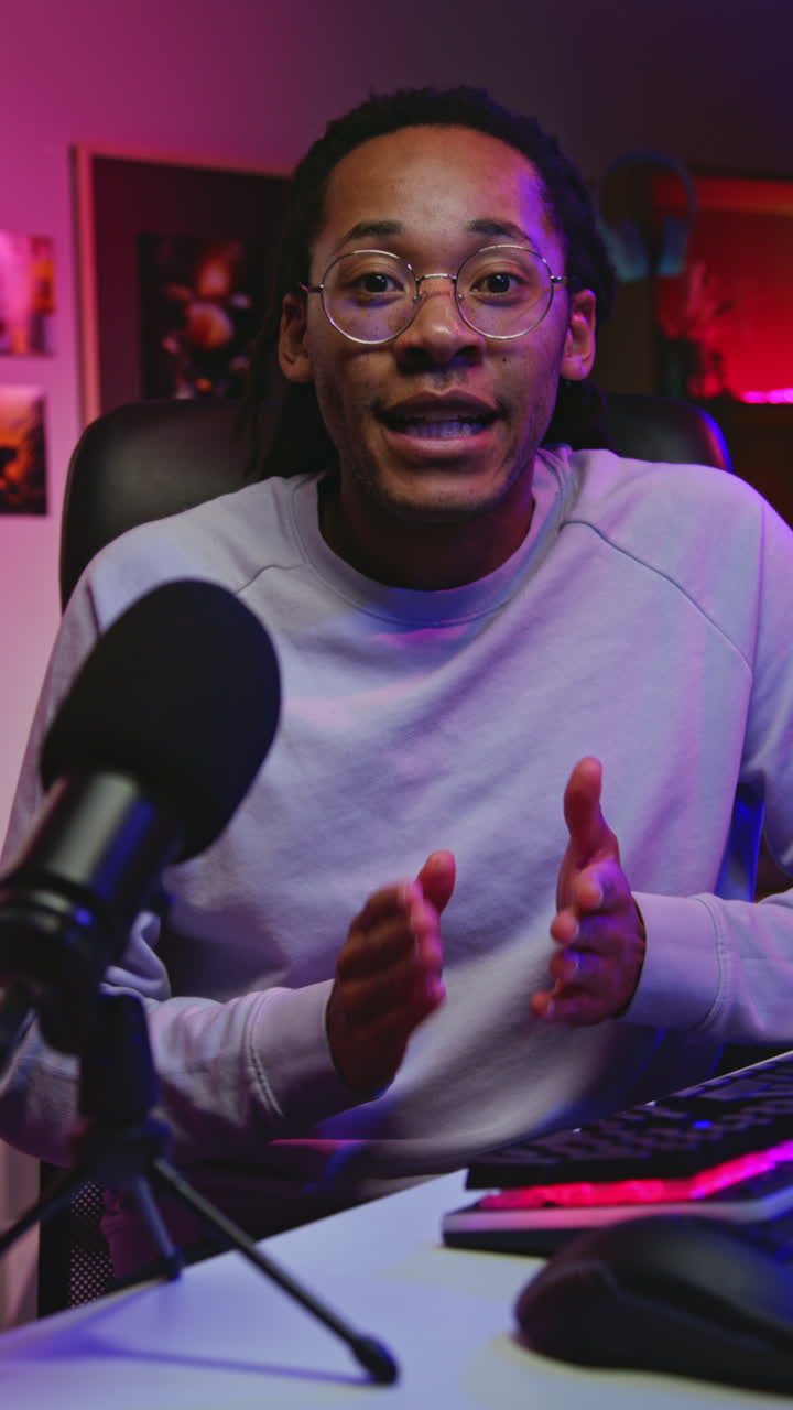 Man Streaming on Twitch with a Microphone and Headset