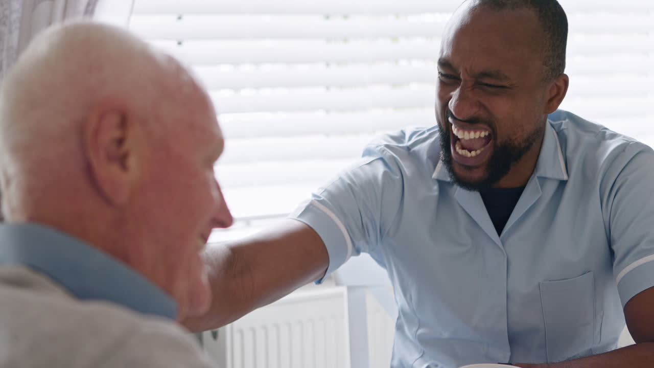 Elderly man with his caregiver