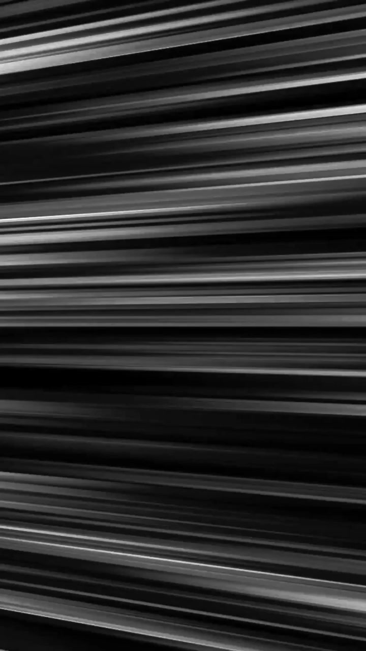 Vertical black and white anime speedlines moving left seamless loop