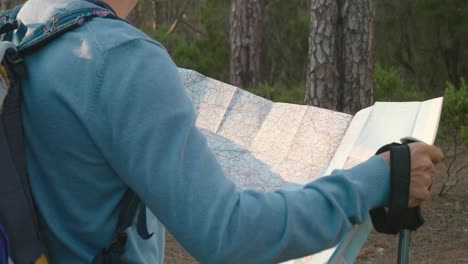 crop male traveler reading map