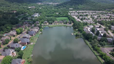 Luxury single-family homes in the Franklin neighborhood of Nashville, Tennessee in a countryside setting around Jackson Lake - aerial flyover