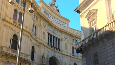 Panning-across-European-style-architecture-of-Galleria-Umberto-I-with-beautiful-pillars,-balconies-and-roman-letters-in-Naples,-Italy