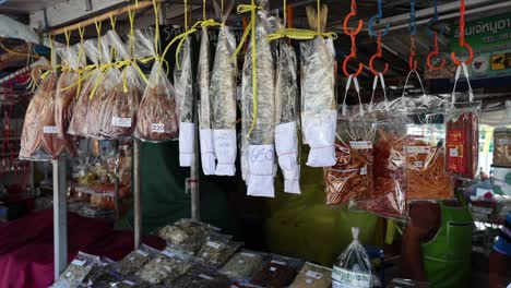 various dried fish displayed at a market stall