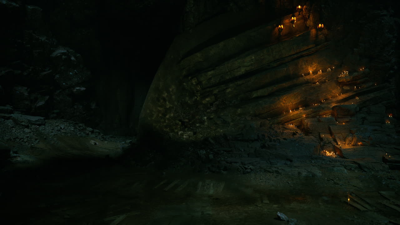 Candlelit cavern with reflective water and illuminated rock formations