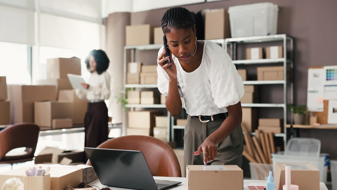 Female Entrepreneur on Phone Managing E-commerce Orders in Office