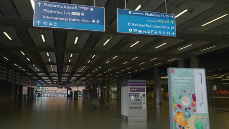 left pan shot revealing empty st pancras station and thank you nhs sign, london, uk