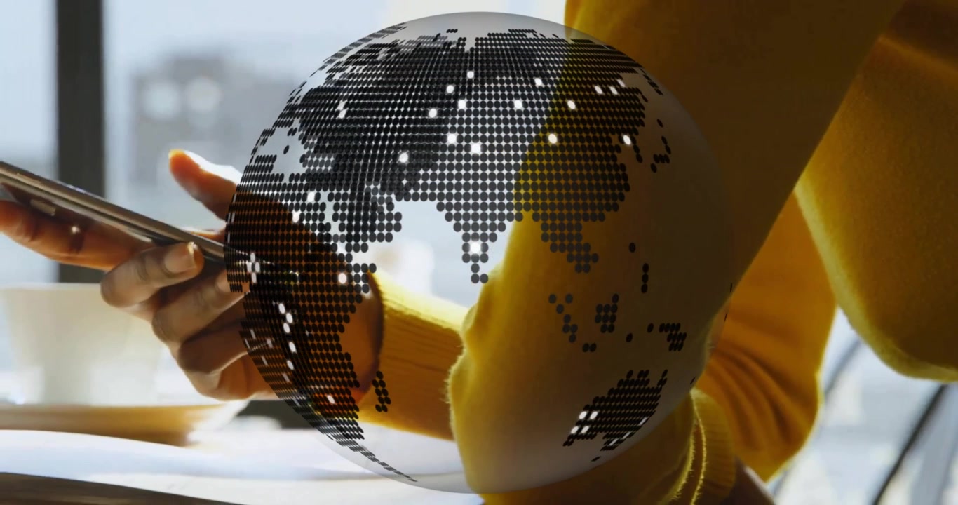 Digital globe materializing and driving sweatered arm lifting smartphone and swiping data overlay