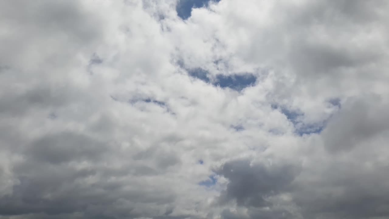 Summer sky rain cloud time lapse in the mid afternoon