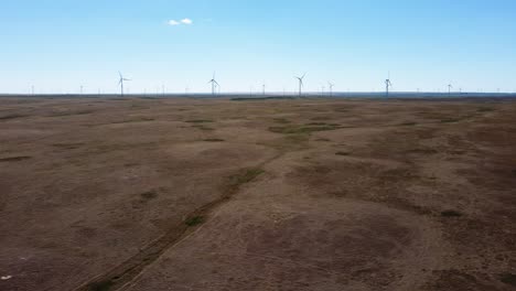 Aerial-Side-Shot-of-the-Wind-Turbines-in-Alberta's-Prairies