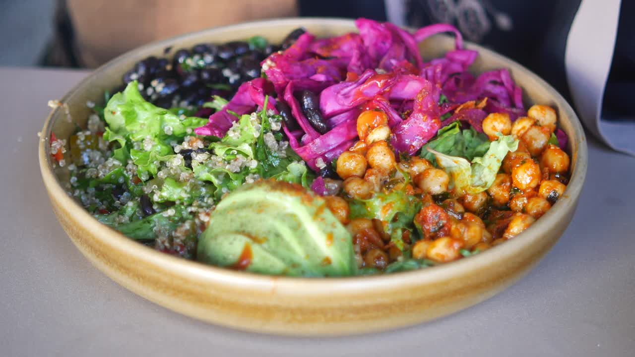 A healthy and colorful salad bowl with various vegetables and ingredients