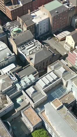 overhead, forward moving social ratio aerial video of the seanad éireann building in dublin city centre, ireland on a bright and sunny day. filmed in 1080x1920 and with rec709 color