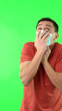 Man wearing face mask on green screen
