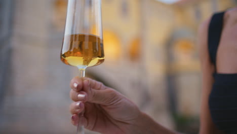 woman enjoying a glass of wine outdoors