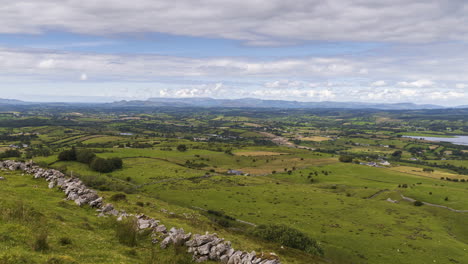 time lapse of rural and remote landscape of grass, trees and rocks during the day in hills of carrowkeel in county sligo, ireland