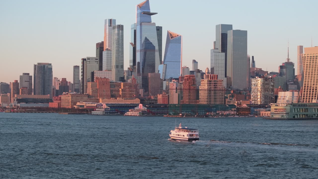 Aerial view of a ferry on The Hudson River at sunset
