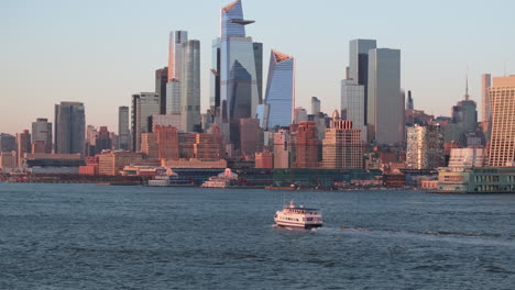 aerial view of a ferry on the hudson river at sunset