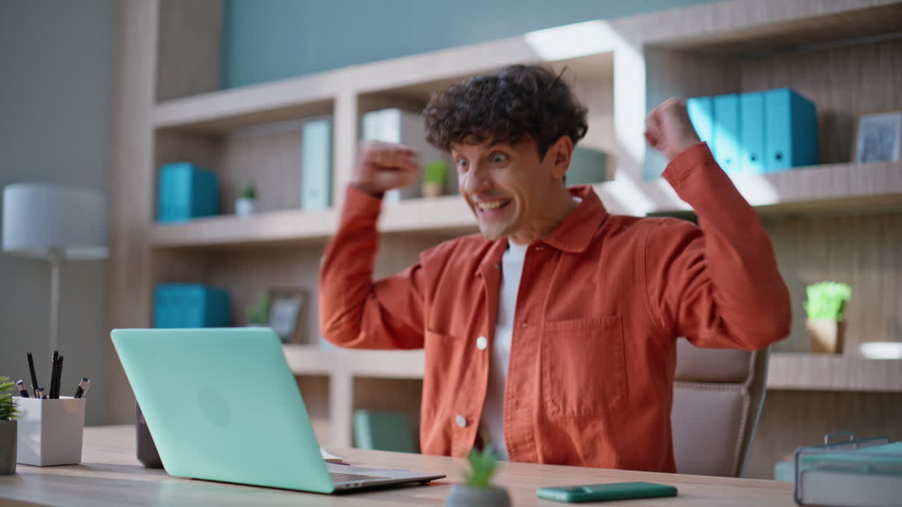 Successful startuper rejoicing achievement looking laptop screen closeup