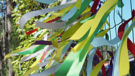 colorful ribbons on a fence