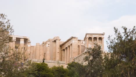 ancient structure surrounded by trees and tourists