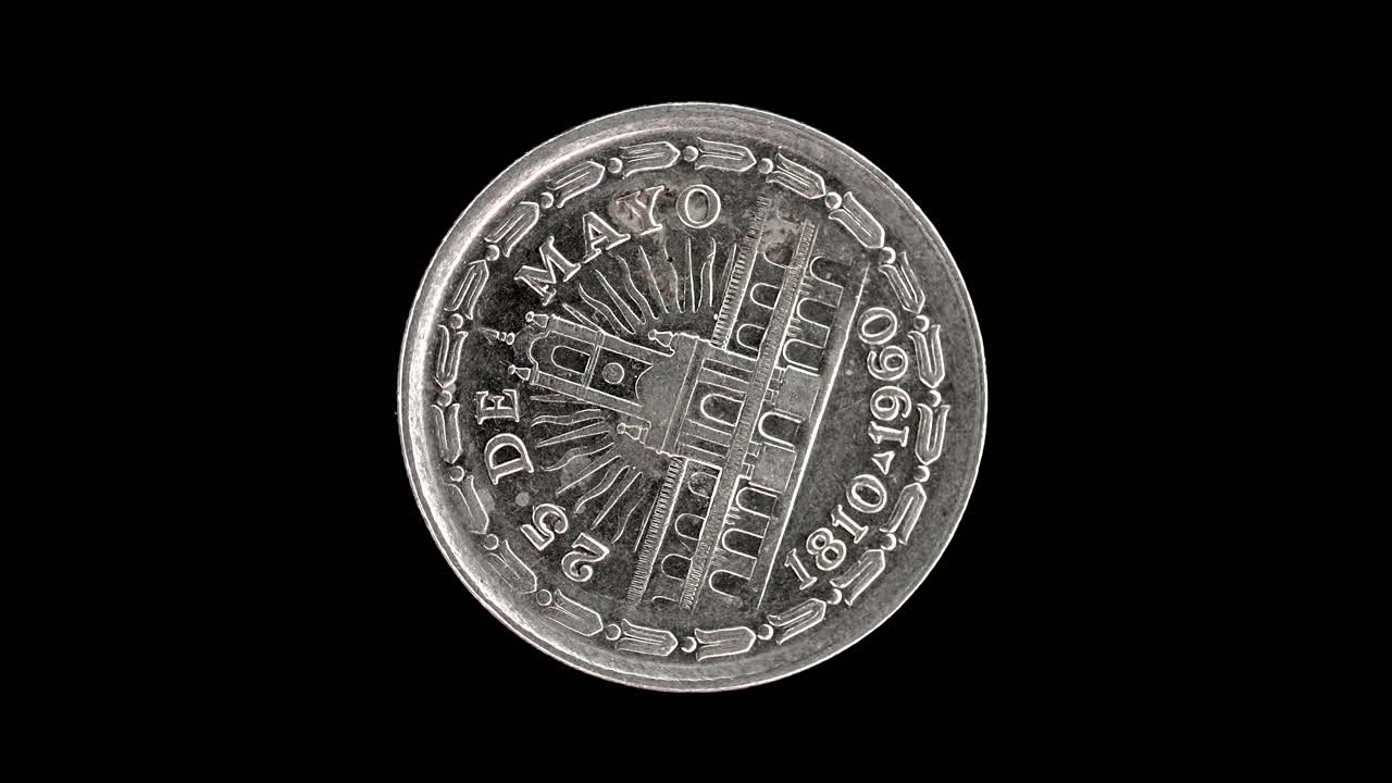 Argentina 1960 1 peso coin reverse with Cabildo building rotating on black background