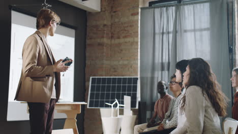 Man-Presenting-Portable-Solar-Charger-on-Renewable-Energy-Conference