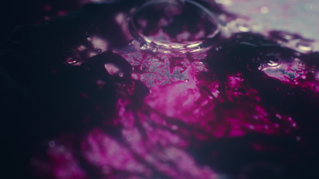 Colourful, organic, liquids macro shots buzzing and flowing