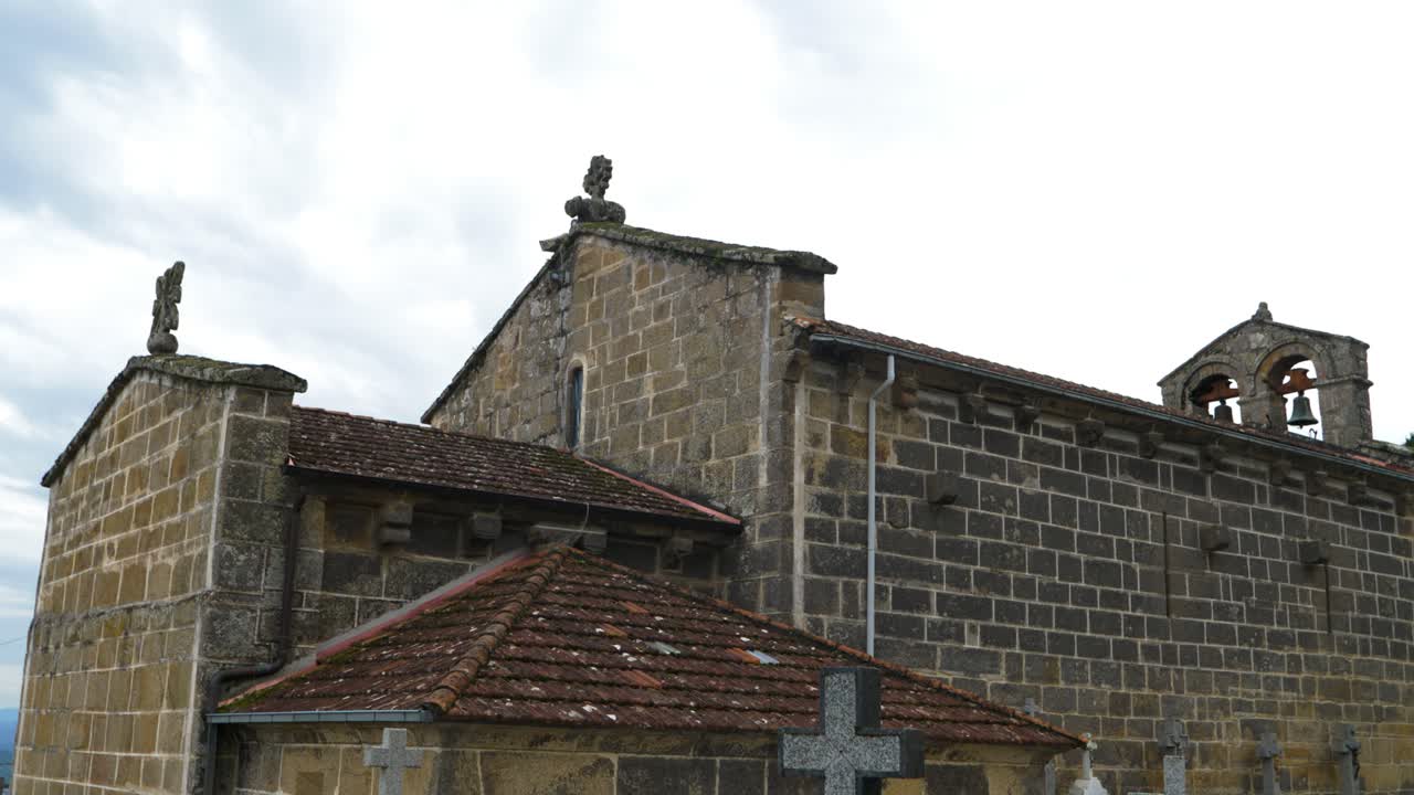 Detailed shot of Santiago de Gustei church doorway with ornate stone arch, Galicia, Spain