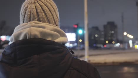 Exploring-European-cities-at-night,-crossing-street-at-green-light