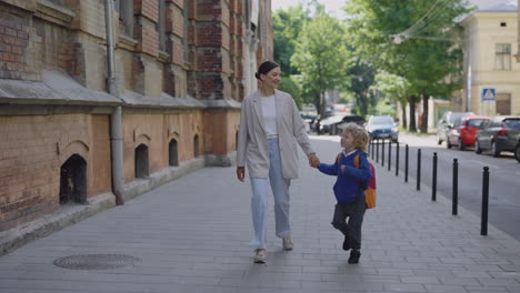 mother and son walking to school