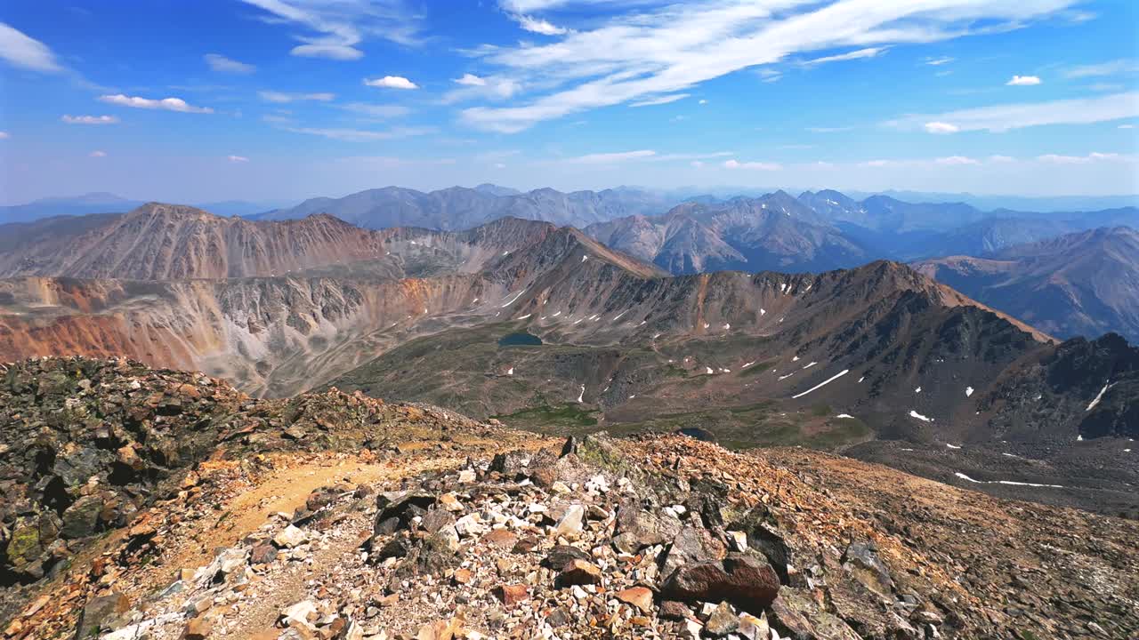Summer Oxford Harvard Columbia Huron Peak Collegiate Peaks hiking trail La Plata Peak Sawatch Range Rocky Mountains top of summit 14er Colorado drone blue sky clouds haze pan left motion