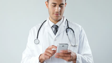 smiling doctor using a smart phone 4k 4k