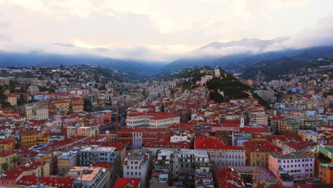 a colorful ligurian town with mediterranean sea backdrop, aerial view