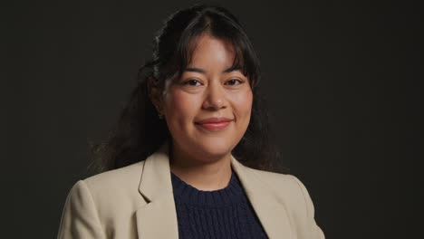 portrait of a smiling woman in a business suit