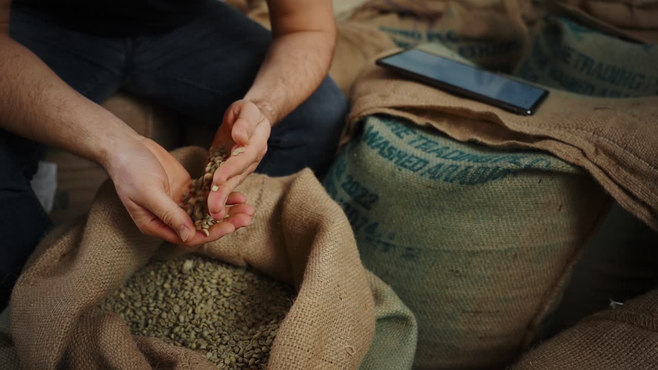 Coffee Farmer Inspecting and Recording Coffee Beans