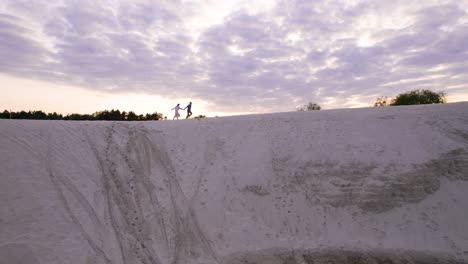 couple on top of a dune