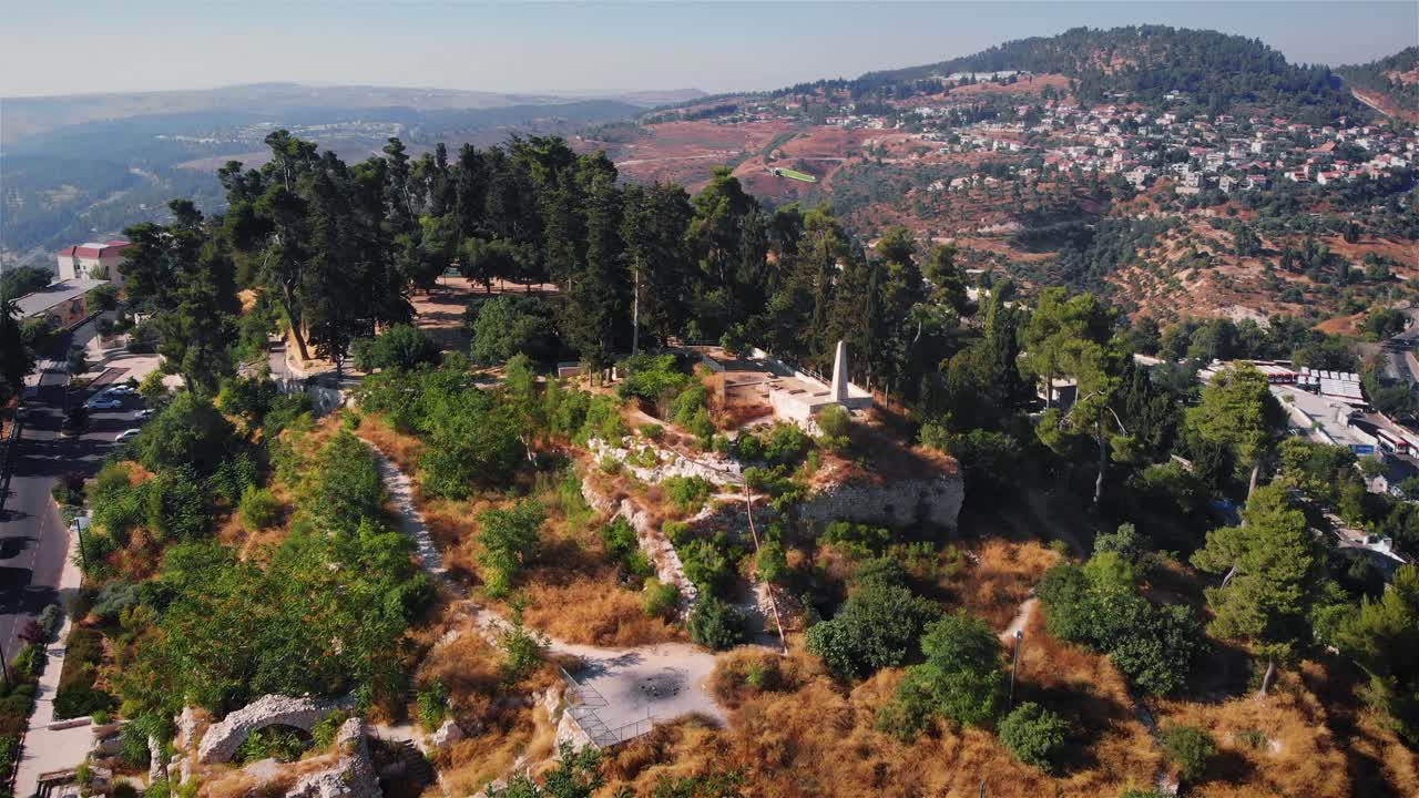 Aerial View of a Hilltop Historical Site with Ancient Ruins and Lush Landscape