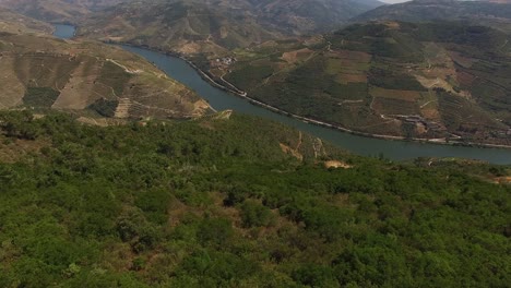 flying over the douro river crossing mountains