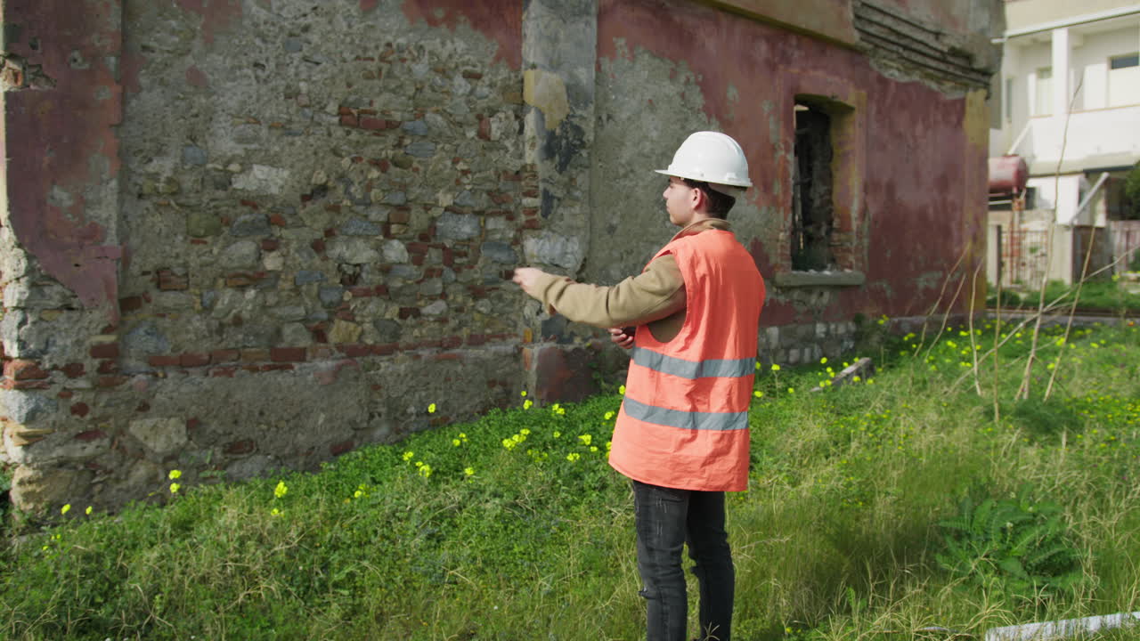 Professional Architect Watching And Analyzing An Old Building
