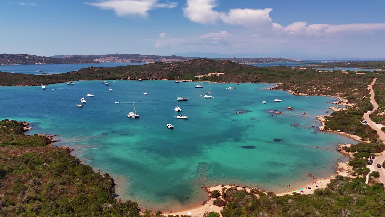 Sardinia coast scenic view with yachts in turquoise water, tranquil vibes