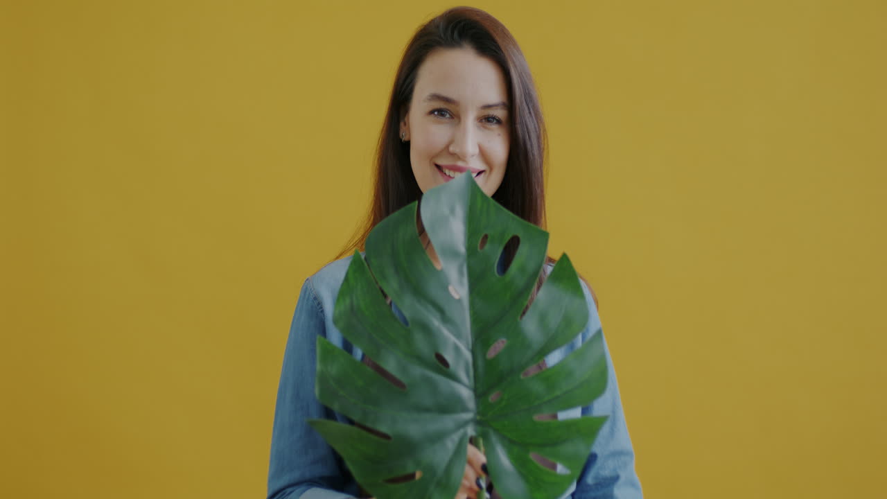 Woman with Monstera Leaf