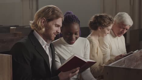 four people reading bible in lutheran church