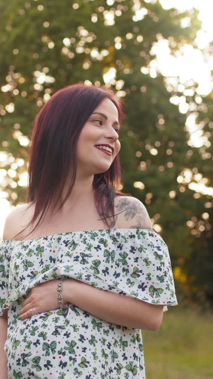 Smiling woman in nature vertical video