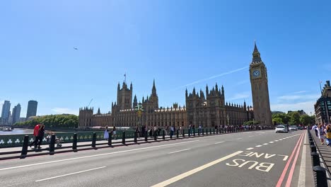 a black cab drives past big ben