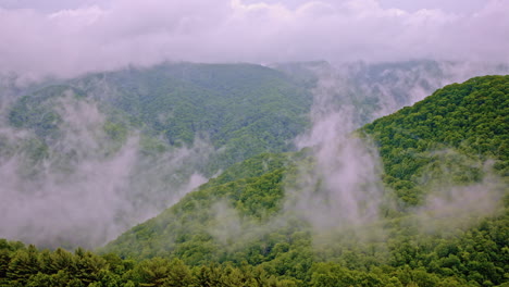 atmospheric drone shot of the fog-filled great smoky mountains