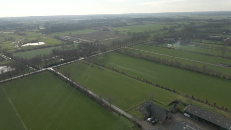 aerial of power lines and electricity transmission towers in rural landscape