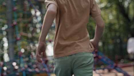 Caucasian-boy-have-fun-at-the-playground-in-summer-day.