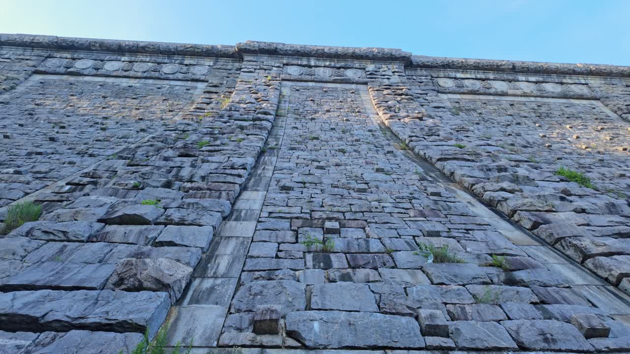 Massive stone wall of Kensico Dam, Valhalla, New York, USA. Extreme low angle view