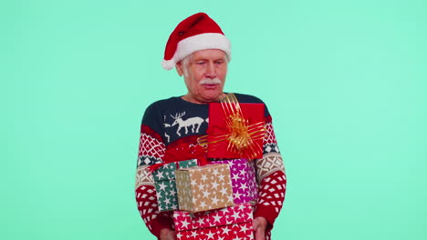 Senior-grandfather-man-in-Christmas-sweater-holding-many-gift-boxes-New-Year-presents-shopping-sale